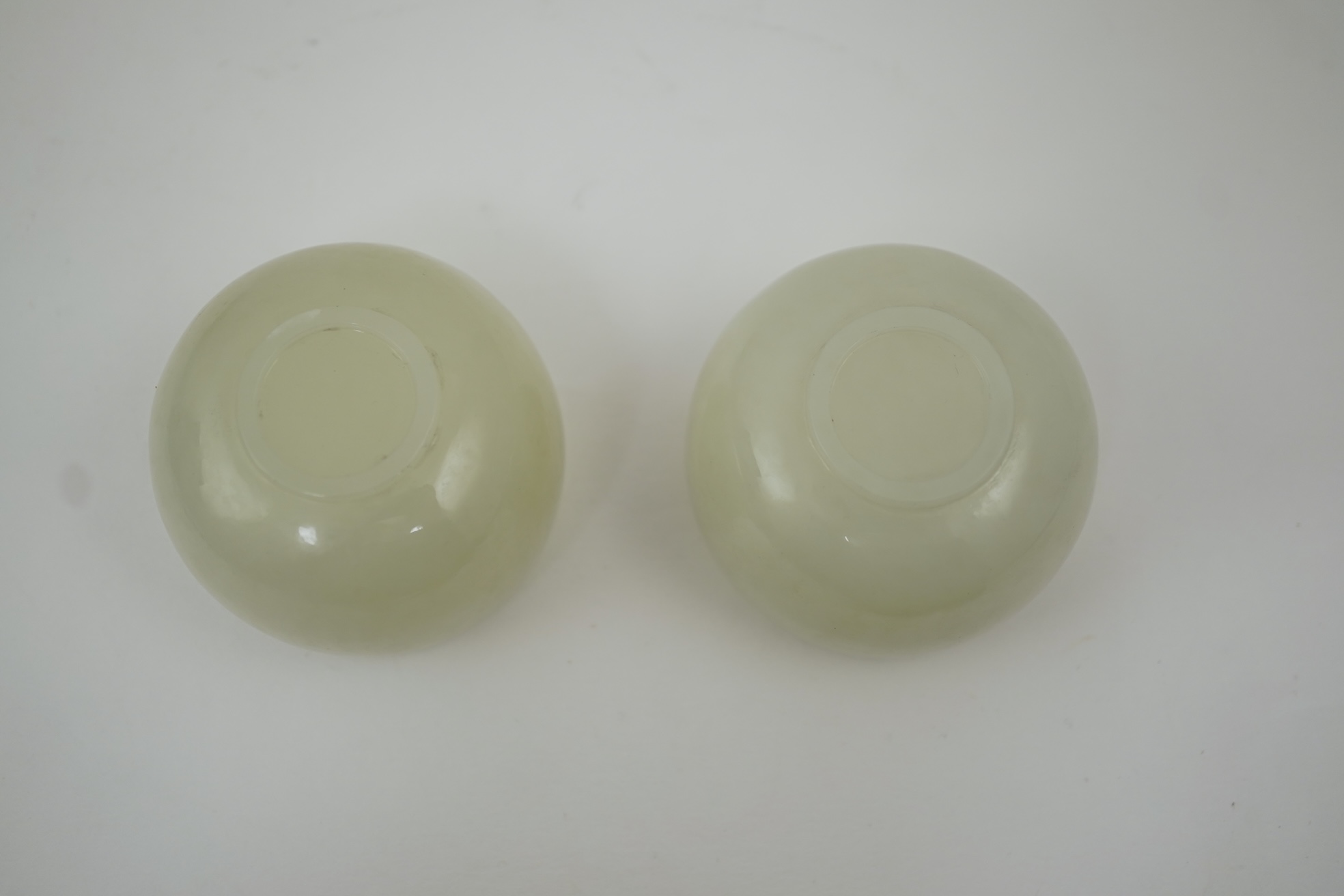 A pair of Chinese white jade cups, Qing dynasty or later